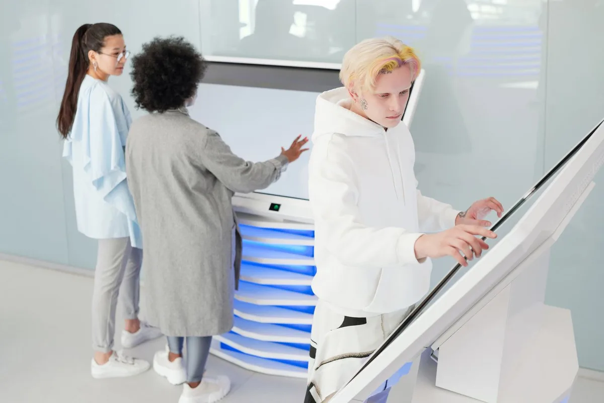 People using large interactive touchscreen displays